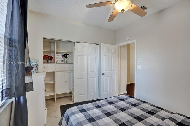 5354 NW 119th Ter, Coral Springs, FL 33076 - bedroom with light tile patterned floors, a closet, and a ceiling fan