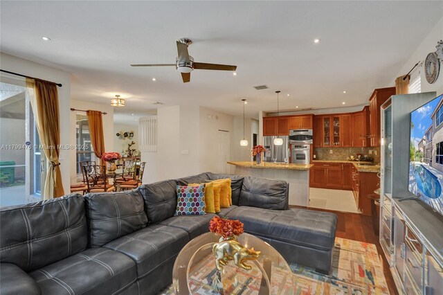 5354 NW 119th Ter, Coral Springs, FL 33076 - living room with light wood-style floors, ceiling fan, and recessed lighting