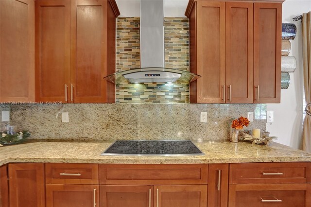 5354 NW 119th Ter, Coral Springs, FL 33076 - kitchen with black electric stovetop, wall chimney exhaust hood, decorative backsplash, and brown cabinets