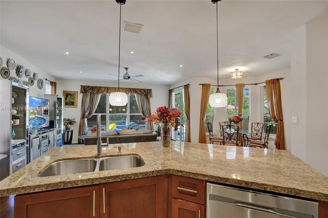 5354 NW 119th Ter, Coral Springs, FL 33076 - kitchen with dishwasher, open floor plan, a sink, brown cabinetry, and ceiling fan