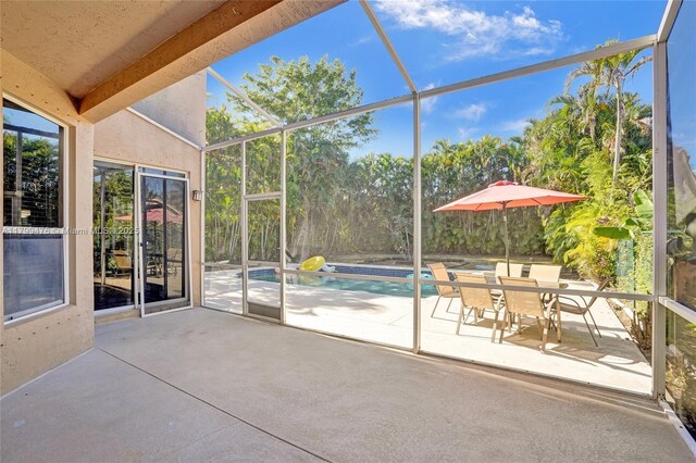 5354 NW 119th Ter, Coral Springs, FL 33076 - view of patio with an outdoor pool and glass enclosure