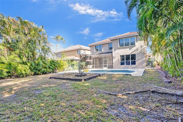 5354 NW 119th Ter, Coral Springs, FL 33076 - back of house with stucco siding, a sunroom, a tiled roof, an outdoor pool, and a patio