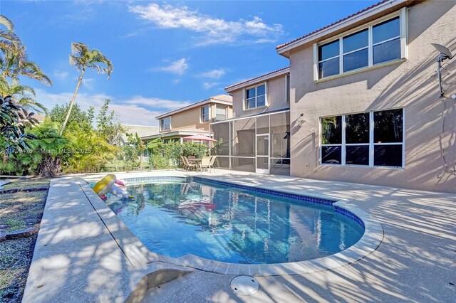 5354 NW 119th Ter, Coral Springs, FL 33076 - outdoor pool with a patio area and a sunroom