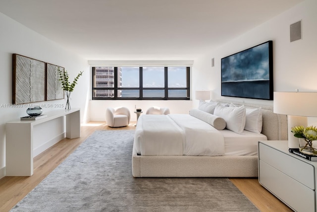 bedroom with light wood-type flooring