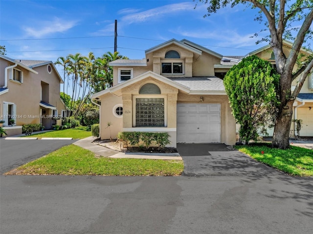 2124 W Discovery Cir W, Deerfield Beach, FL 33442 - multi unit property featuring stucco siding, asphalt driveway, a garage, and roof with shingles