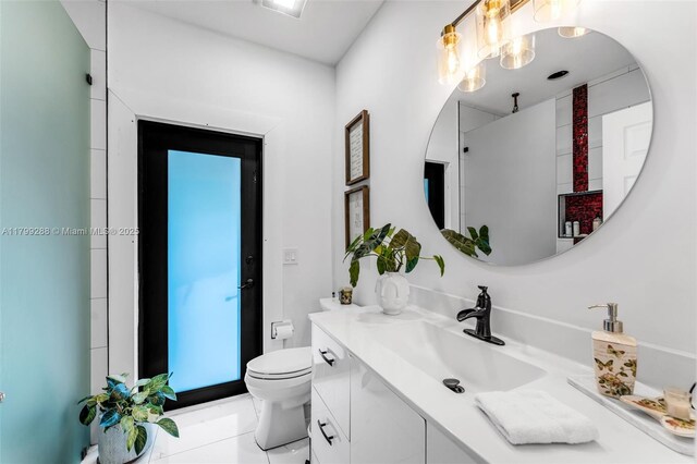 655 SE 37th Ter, Homestead, FL 33033 - bathroom with toilet, vanity, and a chandelier