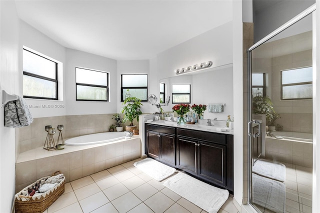 655 SE 37th Ter, Homestead, FL 33033 - full bath with a garden tub, tile patterned floors, double vanity, and a stall shower