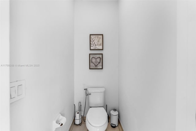 655 SE 37th Ter, Homestead, FL 33033 - bathroom featuring tile patterned flooring, toilet, and baseboards