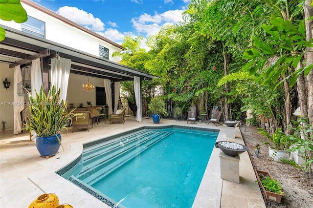 655 SE 37th Ter, Homestead, FL 33033 - view of swimming pool with a patio area and an outdoor hangout area