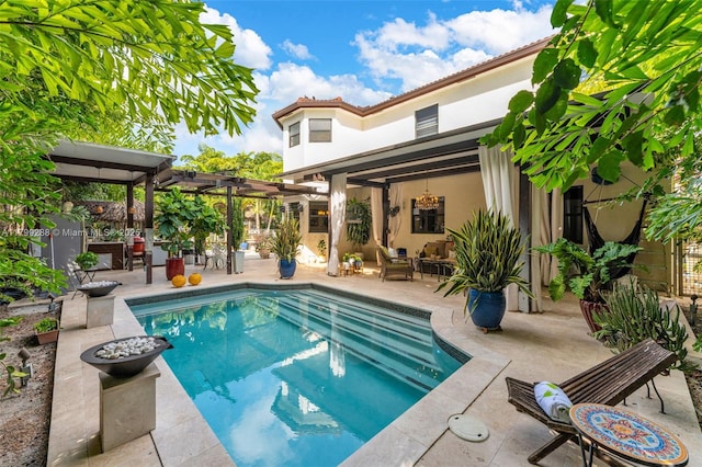 655 SE 37th Ter, Homestead, FL 33033 - swimming pool with a patio area, a pergola, and an outdoor living space