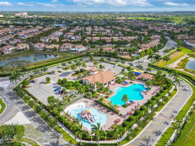 655 SE 37th Ter, Homestead, FL 33033 - aerial overview of property's location with a pool area, a nearby body of water, and nearby suburban area