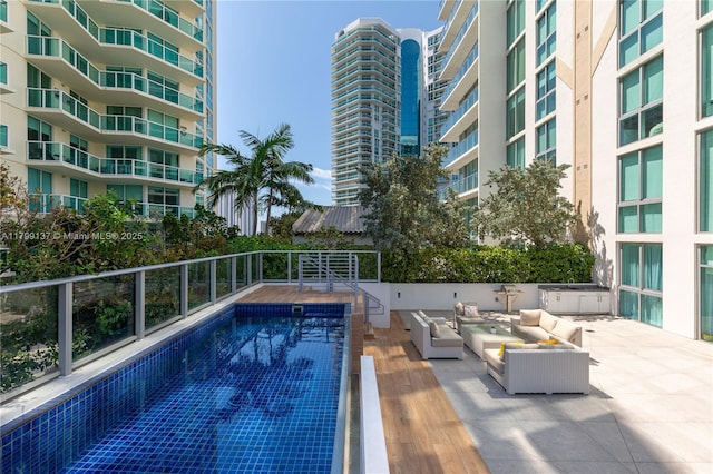 300 Sunny Isles Blvd Unit 4-501, Sunny Isles Beach, FL 33160 - community pool with outdoor lounge area and a patio