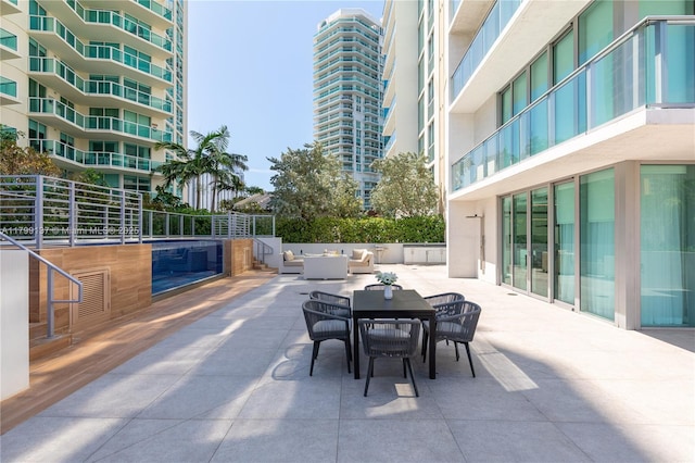 300 Sunny Isles Blvd Unit 4-501, Sunny Isles Beach, FL 33160 - view of patio with outdoor dining space and an outdoor living space