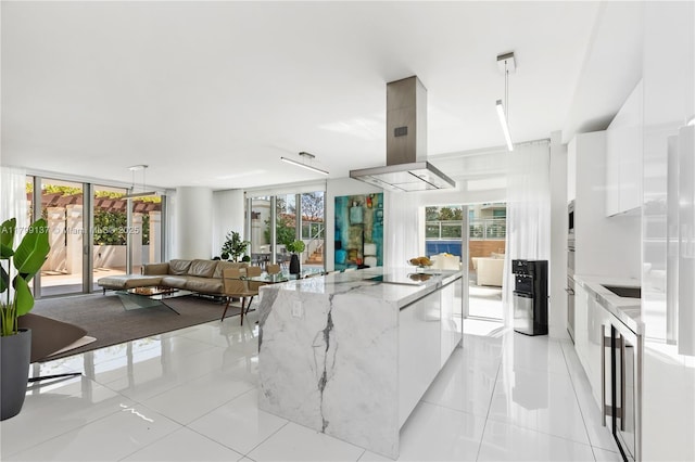 300 Sunny Isles Blvd Unit 4-501, Sunny Isles Beach, FL 33160 - kitchen with modern cabinets, white cabinetry, light tile patterned floors, and a kitchen island
