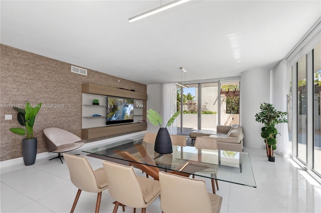 300 Sunny Isles Blvd Unit 4-501, Sunny Isles Beach, FL 33160 - dining area featuring tile patterned flooring, healthy amount of natural light, and an accent wall