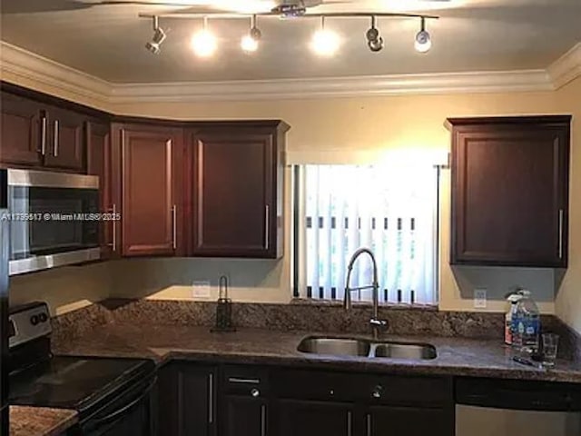 3361 NW 85th Ave Unit 201, Coral Springs, FL 33065 - kitchen featuring appliances with stainless steel finishes, a sink, ornamental molding, dark stone counters, and dark brown cabinetry