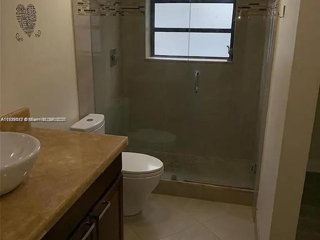 3361 NW 85th Ave Unit 201, Coral Springs, FL 33065 - full bath featuring a shower stall, tile patterned floors, toilet, and vanity