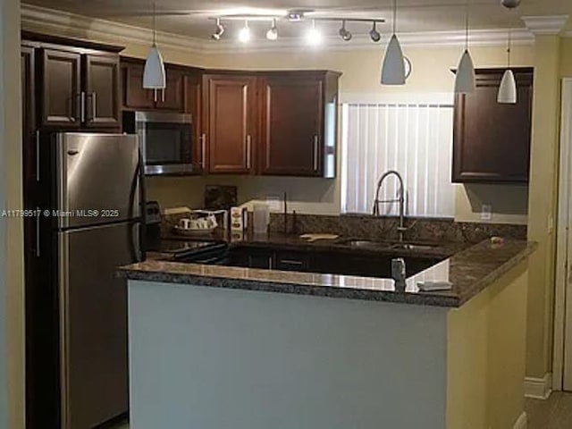 3361 NW 85th Ave Unit 201, Coral Springs, FL 33065 - kitchen with appliances with stainless steel finishes, a sink, a peninsula, dark brown cabinetry, and pendant lighting
