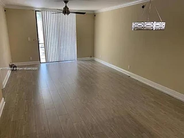 3361 NW 85th Ave Unit 201, Coral Springs, FL 33065 - spare room with crown molding, wood finished floors, baseboards, and ceiling fan