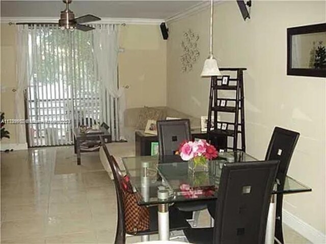 3361 NW 85th Ave Unit 201, Coral Springs, FL 33065 - dining space with ornamental molding and ceiling fan