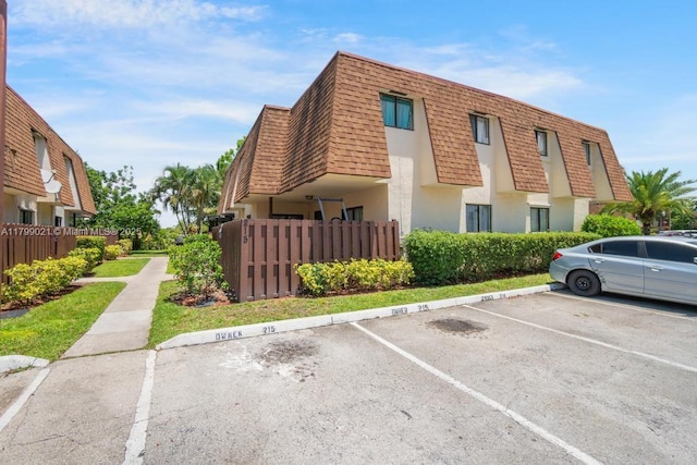 216 San Remo Blvd, North Lauderdale, FL 33068 - view of property with uncovered parking and fence