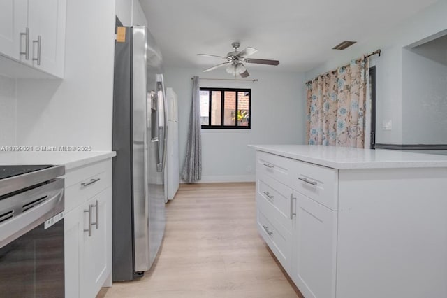 216 San Remo Blvd, North Lauderdale, FL 33068 - kitchen with stainless steel fridge, a ceiling fan, light countertops, stove, and light wood-type flooring