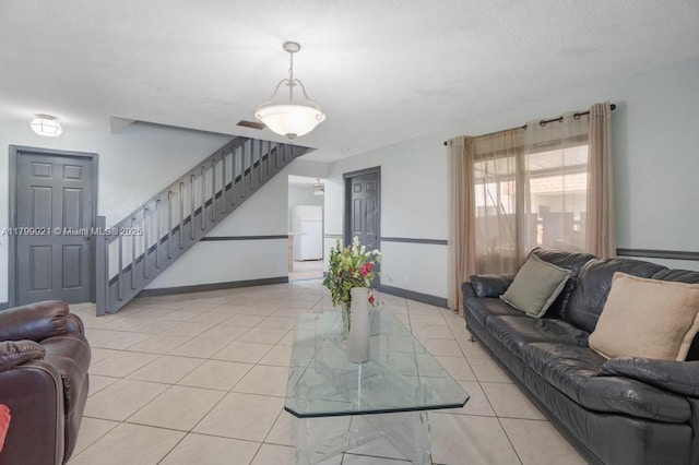 216 San Remo Blvd, North Lauderdale, FL 33068 - living area with stairway, light tile patterned floors, and baseboards