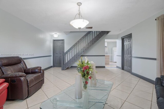 216 San Remo Blvd, North Lauderdale, FL 33068 - living room featuring stairs, baseboards, and light tile patterned floors