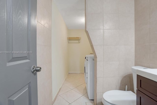 216 San Remo Blvd, North Lauderdale, FL 33068 - bathroom with tile walls, vanity, tile patterned floors, and washer and dryer