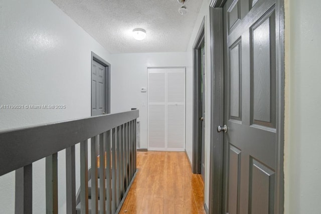 216 San Remo Blvd, North Lauderdale, FL 33068 - hall with light wood-style floors and a textured ceiling