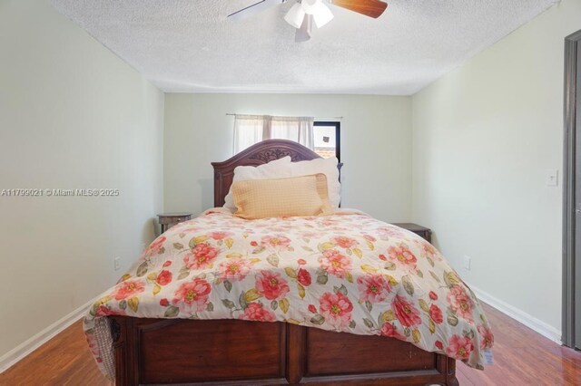 216 San Remo Blvd, North Lauderdale, FL 33068 - bedroom with wood finished floors, a textured ceiling, baseboards, and ceiling fan