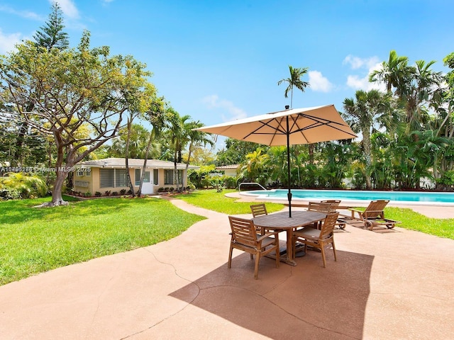 10643 NE 10th Pl, Miami Shores, FL 33138 - view of patio / terrace with an outdoor pool