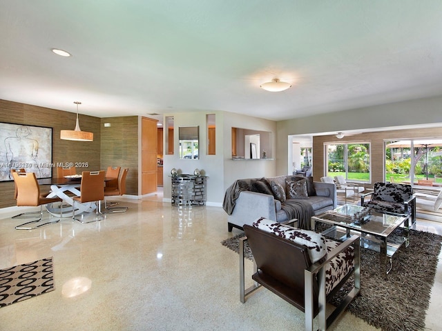 10643 NE 10th Pl, Miami Shores, FL 33138 - living room featuring baseboards and speckle patterned floor