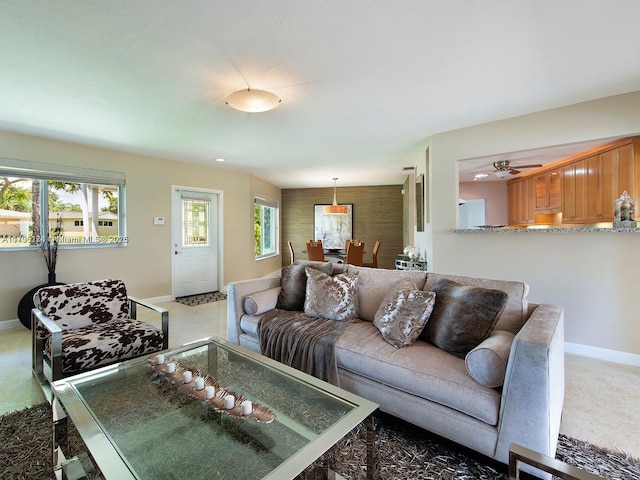 10643 NE 10th Pl, Miami Shores, FL 33138 - carpeted living room featuring baseboards and ceiling fan