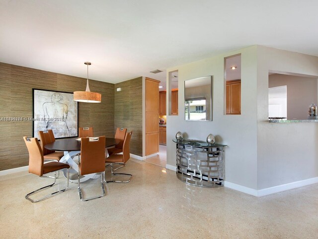 10643 NE 10th Pl, Miami Shores, FL 33138 - dining area featuring baseboards and speckle patterned floor