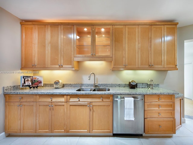 10643 NE 10th Pl, Miami Shores, FL 33138 - kitchen featuring dishwasher, light stone countertops, glass insert cabinets, light tile patterned floors, and brown cabinets