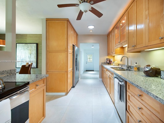 10643 NE 10th Pl, Miami Shores, FL 33138 - kitchen with appliances with stainless steel finishes, light stone countertops, ceiling fan, light tile patterned flooring, and recessed lighting