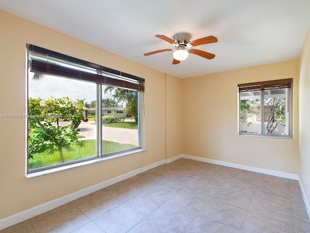10643 NE 10th Pl, Miami Shores, FL 33138 - empty room featuring ceiling fan and light tile patterned floors