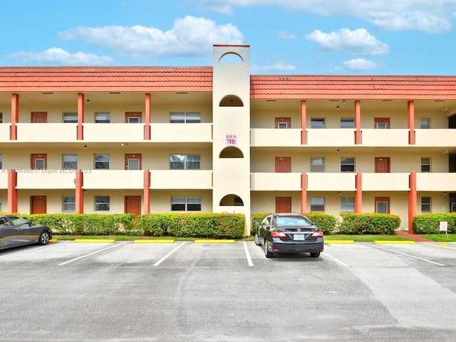 7891 N Sunrise Lakes Dr Unit 101, Sunrise, FL 33322 - view of apartment building / complex featuring uncovered parking