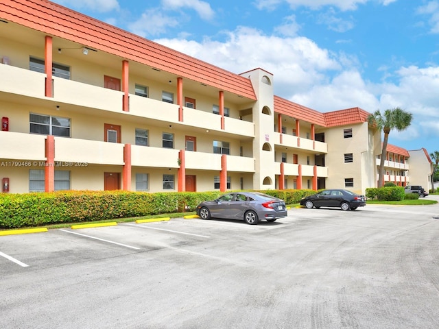 7891 N Sunrise Lakes Dr Unit 101, Sunrise, FL 33322 - view of apartment building / complex with uncovered parking