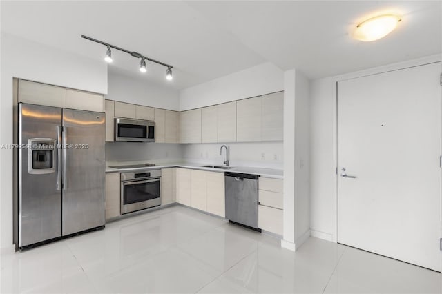 4250 Biscayne Blvd Unit 1112, Miami, FL 33137 - kitchen with stainless steel appliances, modern cabinets, a sink, light countertops, and track lighting