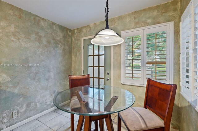 3568 Quail Trl, Melbourne, FL 32935 - tiled dining room featuring baseboards