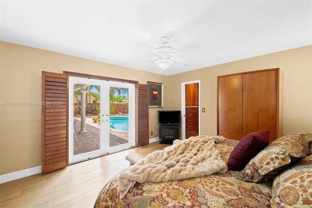 5221 Roosevelt St, Hollywood, FL 33021 - bedroom featuring access to exterior, baseboards, light wood-style flooring, a ceiling fan, and french doors