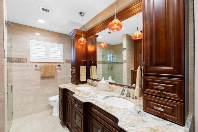 5221 Roosevelt St, Hollywood, FL 33021 - bathroom with a shower stall, toilet, double vanity, and tile walls