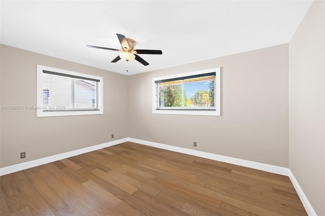5221 Roosevelt St, Hollywood, FL 33021 - empty room featuring baseboards, wood finished floors, and ceiling fan