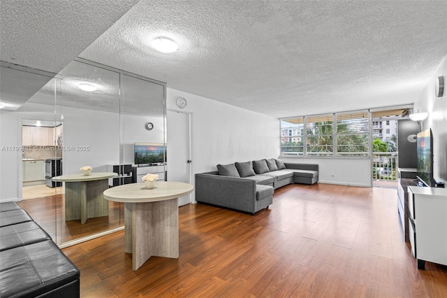 251 174th St Unit 212, Sunny Isles Beach, FL 33160 - living area with dark wood-type flooring and a textured ceiling
