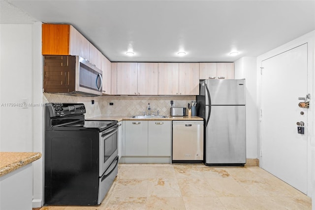 251 174th St Unit 212, Sunny Isles Beach, FL 33160 - kitchen featuring stainless steel appliances, backsplash, and a sink