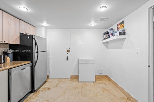 251 174th St Unit 212, Sunny Isles Beach, FL 33160 - kitchen featuring appliances with stainless steel finishes, light brown cabinets, light countertops, and baseboards