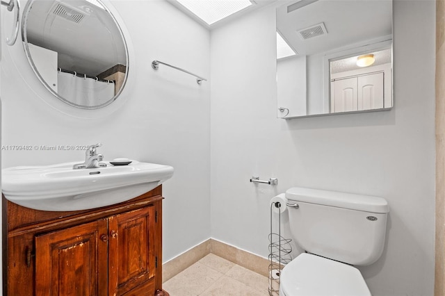 251 174th St Unit 212, Sunny Isles Beach, FL 33160 - full bath featuring baseboards, tile patterned flooring, toilet, and vanity