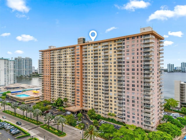 251 174th St Unit 212, Sunny Isles Beach, FL 33160 - view of apartment building / complex featuring a water view, a city view, and uncovered parking
